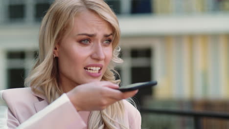 Close up view of woman talking on the phone on the street