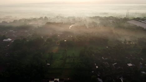 Cinematic-Aerial-View-Of-Village-At-the-Base-of-Mount-Argopuro-at-Sunrise