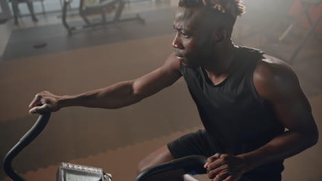 man working out on an exercise bike in a gym