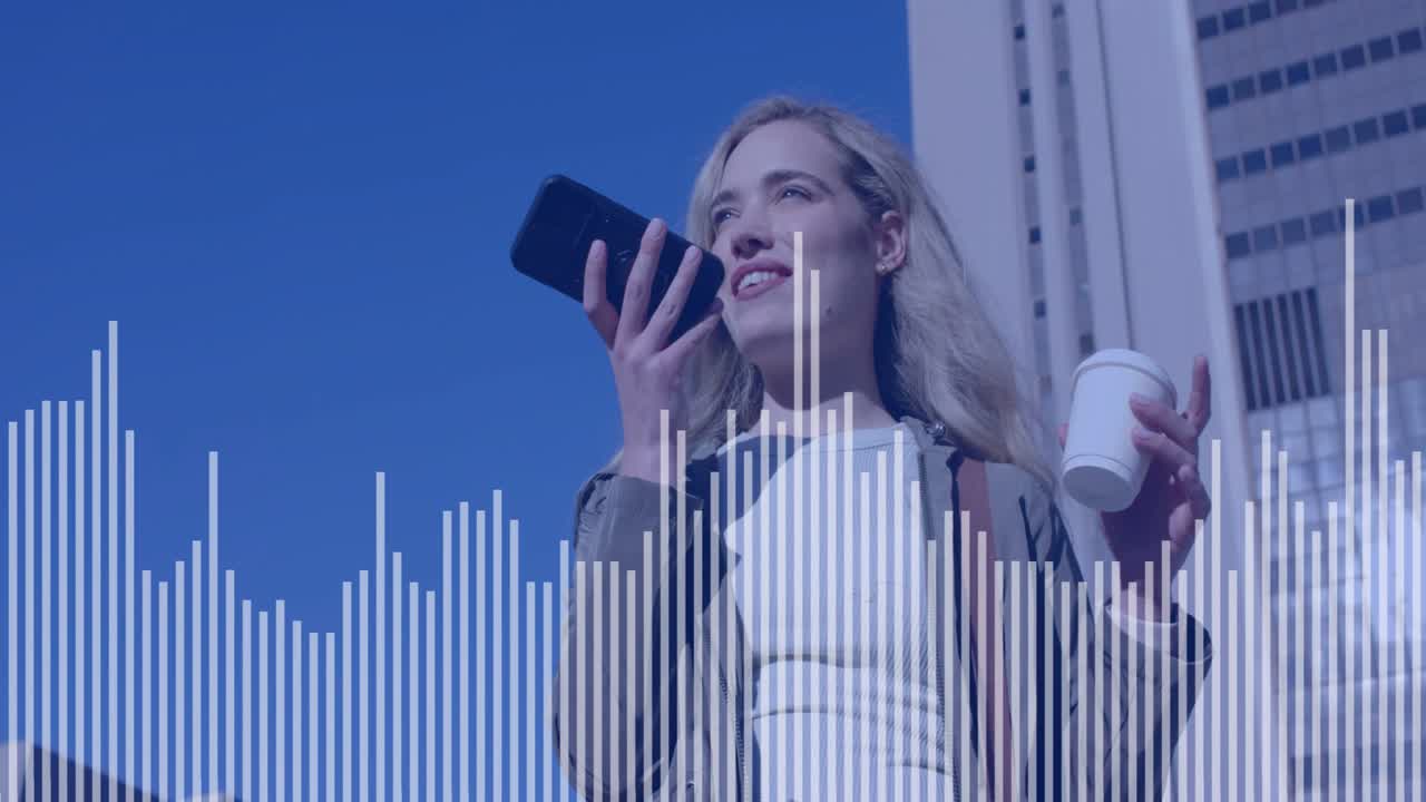 Woman speaking into phone on street recording voice memo while waveform reacting to voice for tech
