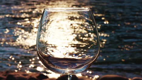 wine glass at sunset on the beach
