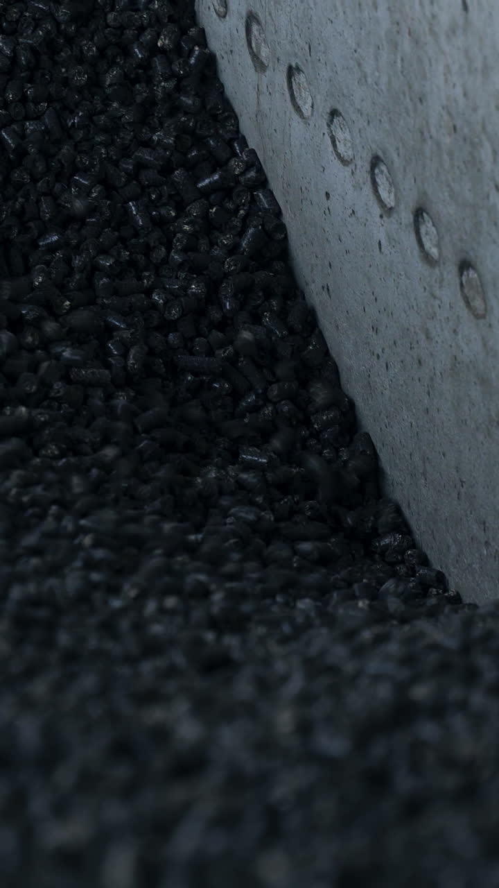 Full storage of coal in elevator storage. Dark elevator heating chemical coal. Vertical video