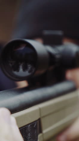 hunter with gun on forest. close up of the hunter man shooting with hunting rifle on nature