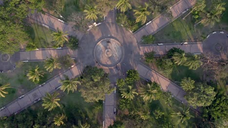Top-View-Of-Ornamental-Fountain-At-The-Center-Of-Garden-With-Tree-Palms-In-Jardín-Núñez,-Colima-Mexico