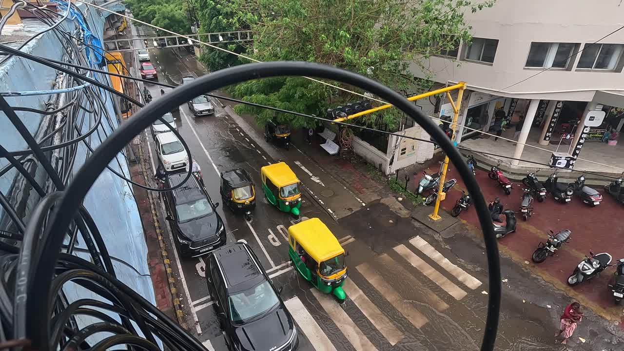 wide view, Men are obeying traffic signals under the bridge even in the pouring rain