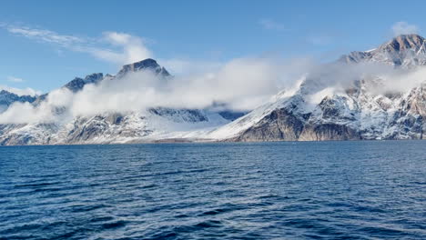 clouds on mountains in east greenland