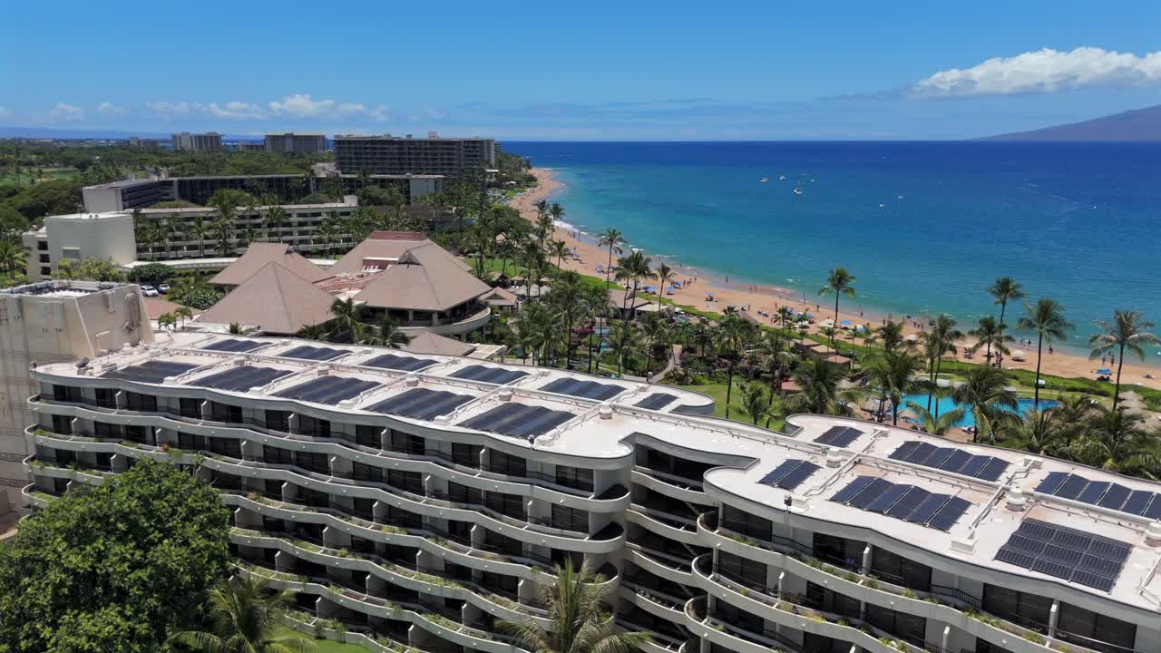 Aerial reveal of Kaanapali beach over the Sheraton resort hotel in Maui, Hawaii