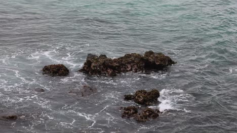 time-lapse of waves hitting rocky coastline