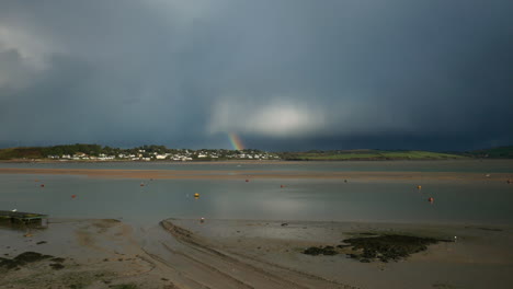 view across the camel estuary towards rock in cornwall on a stormy day