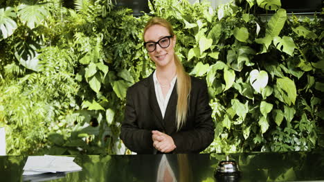 blonde receptionist behind the counter