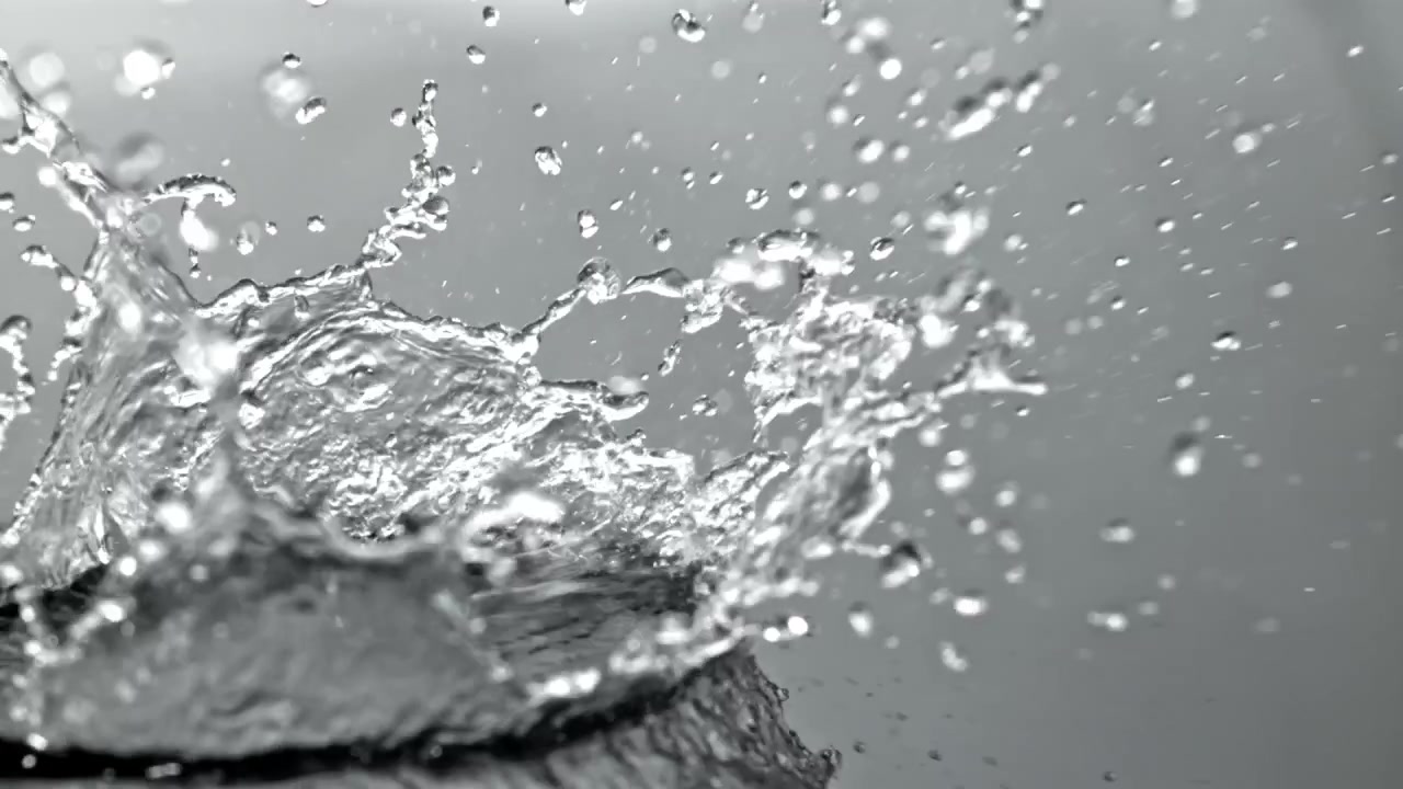 Close-up Slow Motion of Water Splashing on a Surface