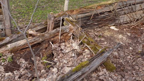 remains of wooden homestead in close up panning view