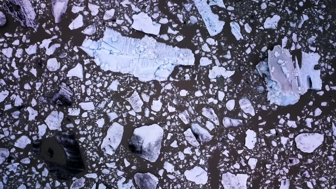 Aerial view of icebergs and glacial lake