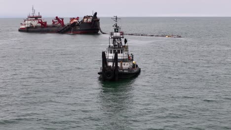 A-tugboat-assists-in-the-San-Clemente-sand-replacement-project,-2024