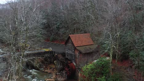 glade creek grist mill in west virginia with bridge and drone video pulling out