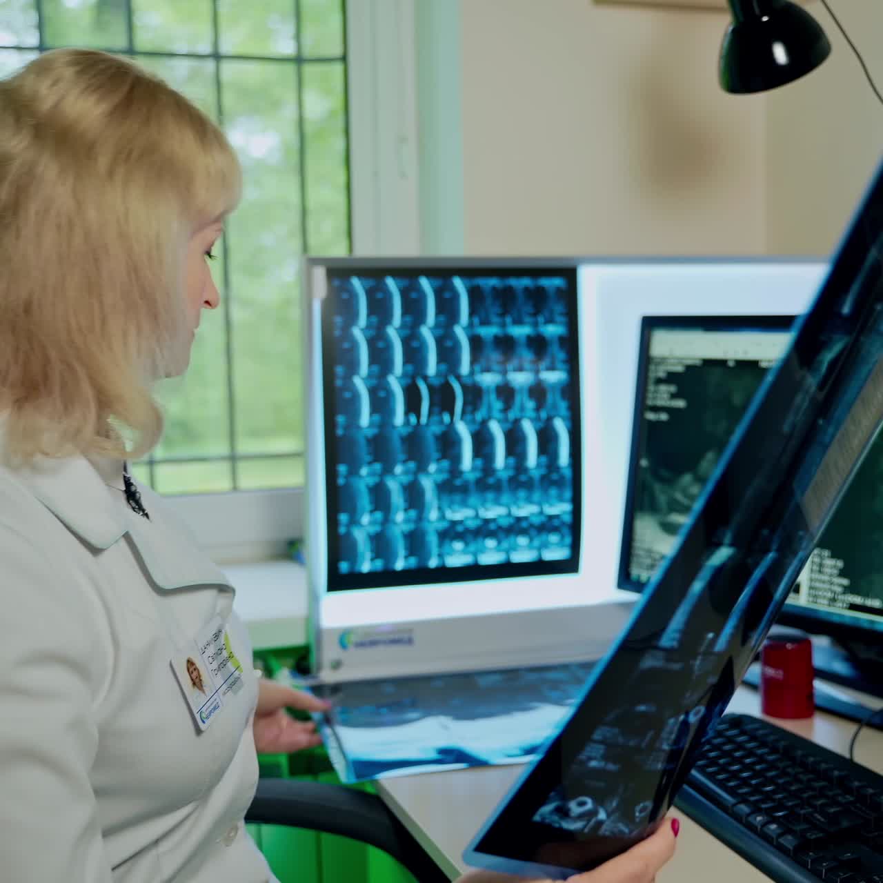 Female doctor looking at x-ray