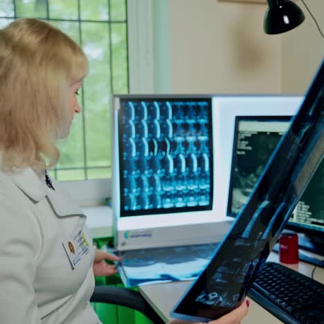 female doctor looking at x-ray