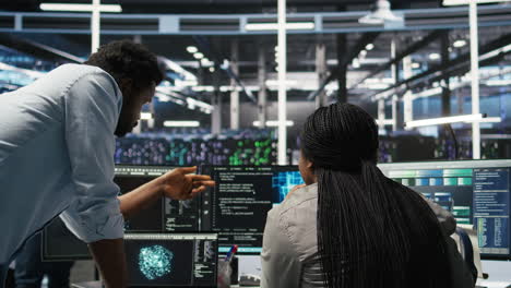 data center manager supervising worker deploying ai solutions