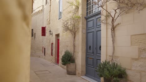limestone building with colourful doors in malta, charming mediterranean island