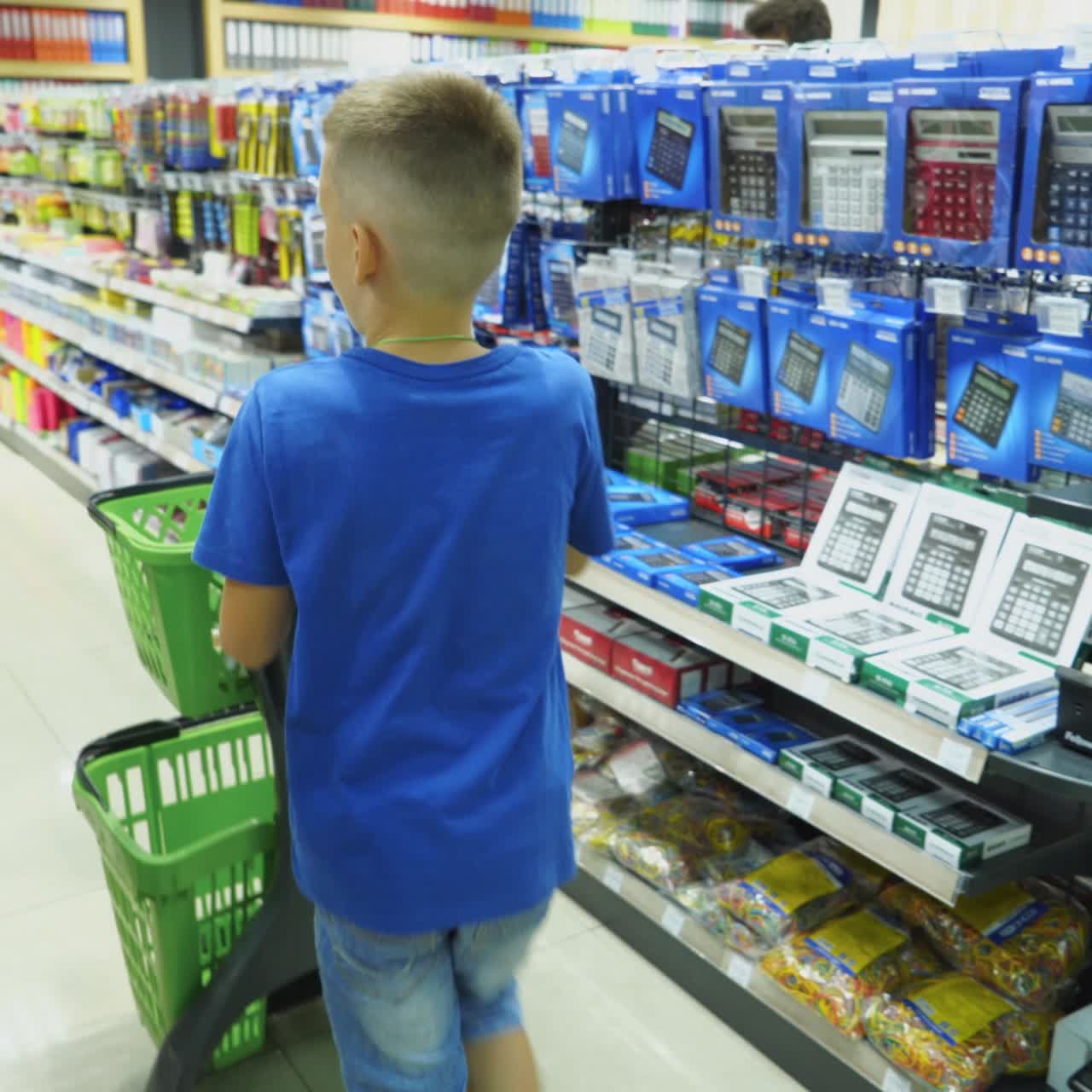 VINNITSA, UKRAINE - AUGUST 20, 2018: Buying school supplies at the supermarket. School goods in the store.
