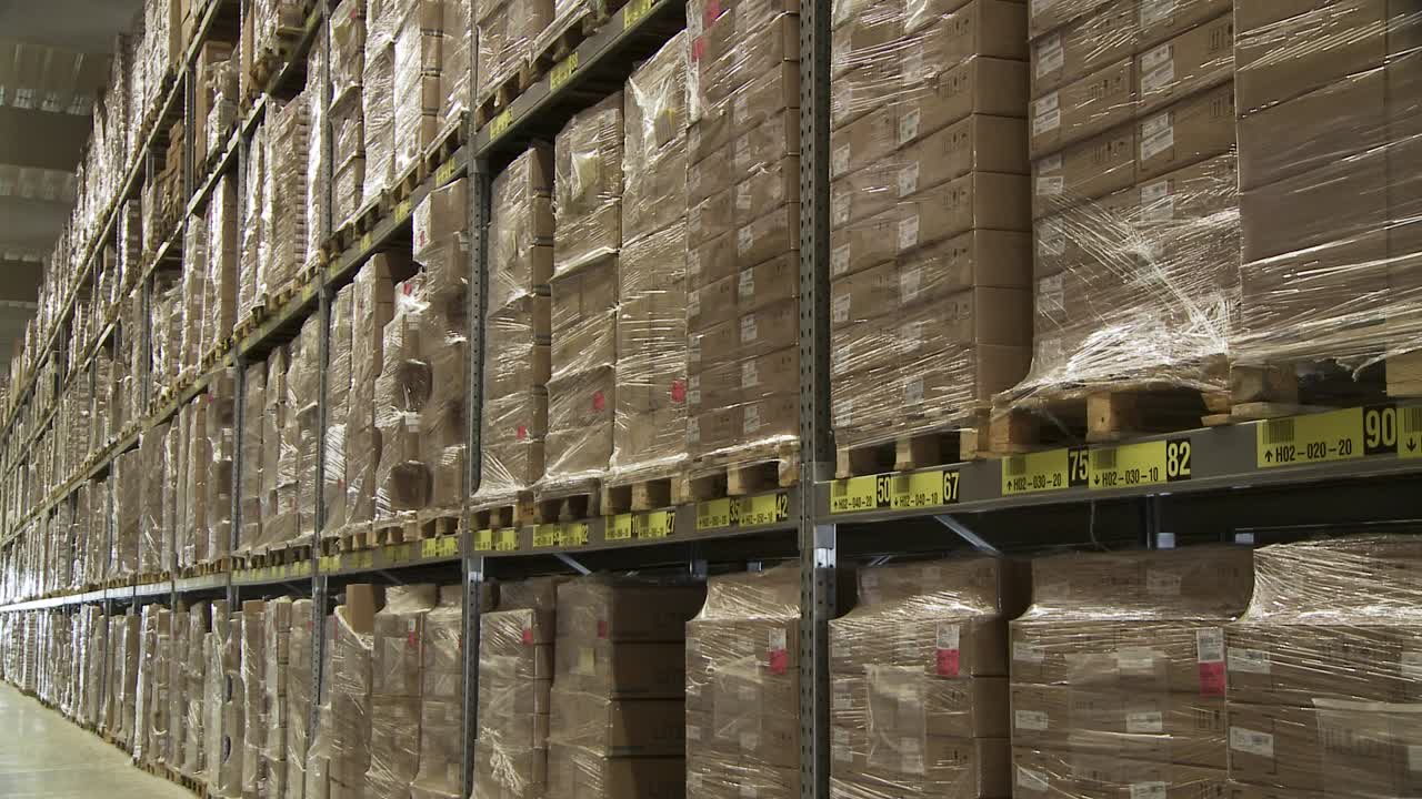 Massive Warehouse Storage of Cardboard Boxes on Pallets