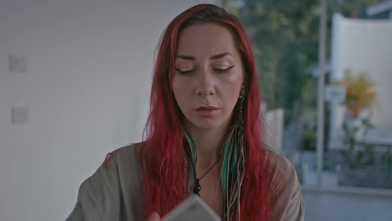 Woman holding tarot card