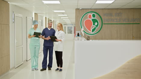 medical professionals in hospital corridor