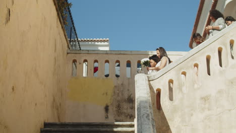 happy brides descending stairs after wedding ceremony