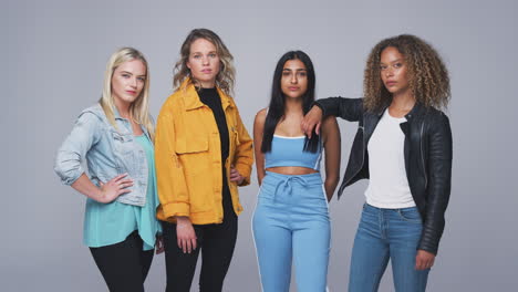 Studio-Shot-Of-Young-Independent-Multi-Cultural-Female-Friends-Looking-Into-Camera-In-Slow-Motion