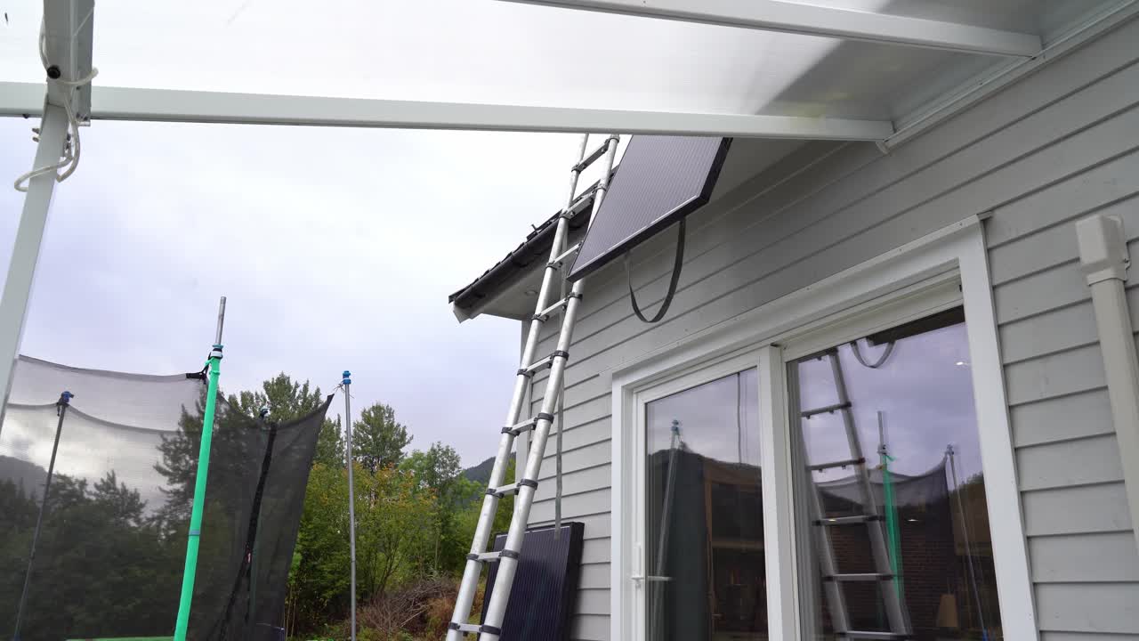 Solar panel lowered down from roof of private home - Removal of failed solar panel installation with low yield - Static