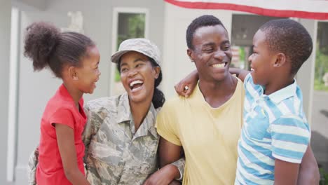 Animation-of-happy-african-american-family-welcoming-soldier-mother-returning-home