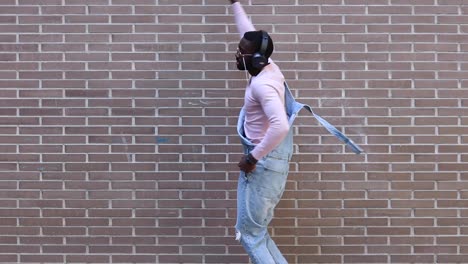 Stylish-black-man-dancing-on-street