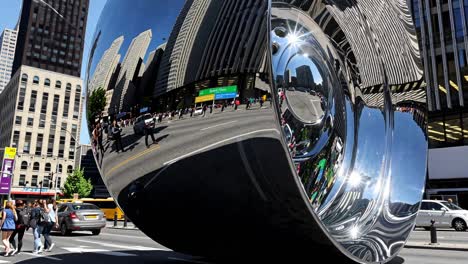 giant mirror tire sculpture in the city