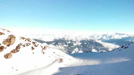 Hochzillertal---Austria-Aerials-of-the-mountains-and-ski-lines-with-blue-skies-in-a-sunny-day