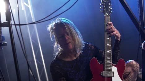 Slow-Motion-Shot-Of-Musician-Playing-Guitar-Emotionally-On-Stage