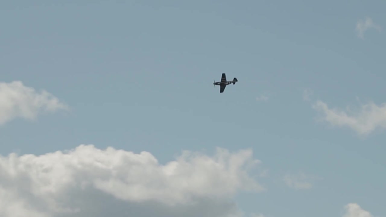 World War II P52 Mustang plane flying by