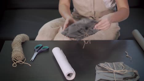 woman wrapping a gift