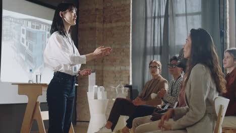 Asian-Businesswoman-Giving-Handshakes-to-Audience-after-Presentation