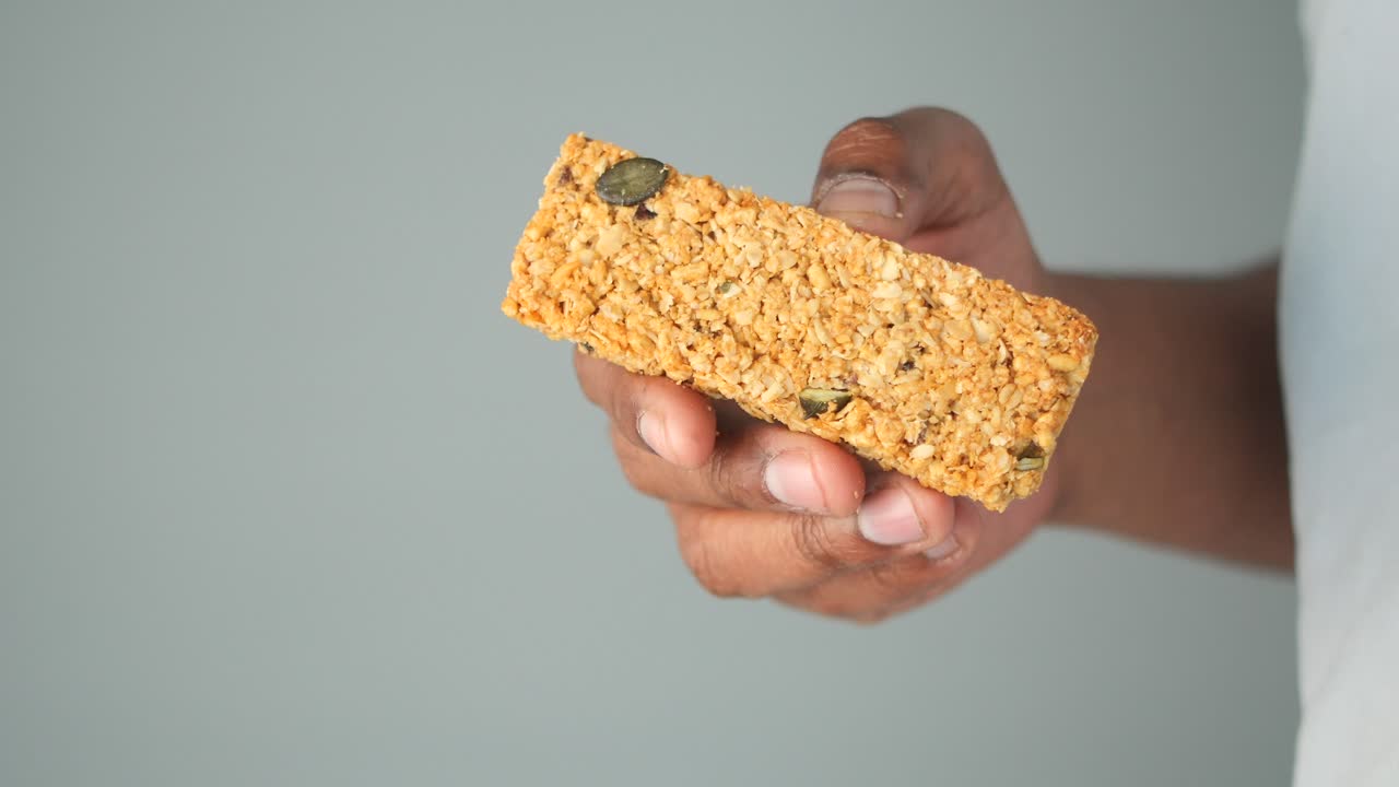 Granola bar held in hand