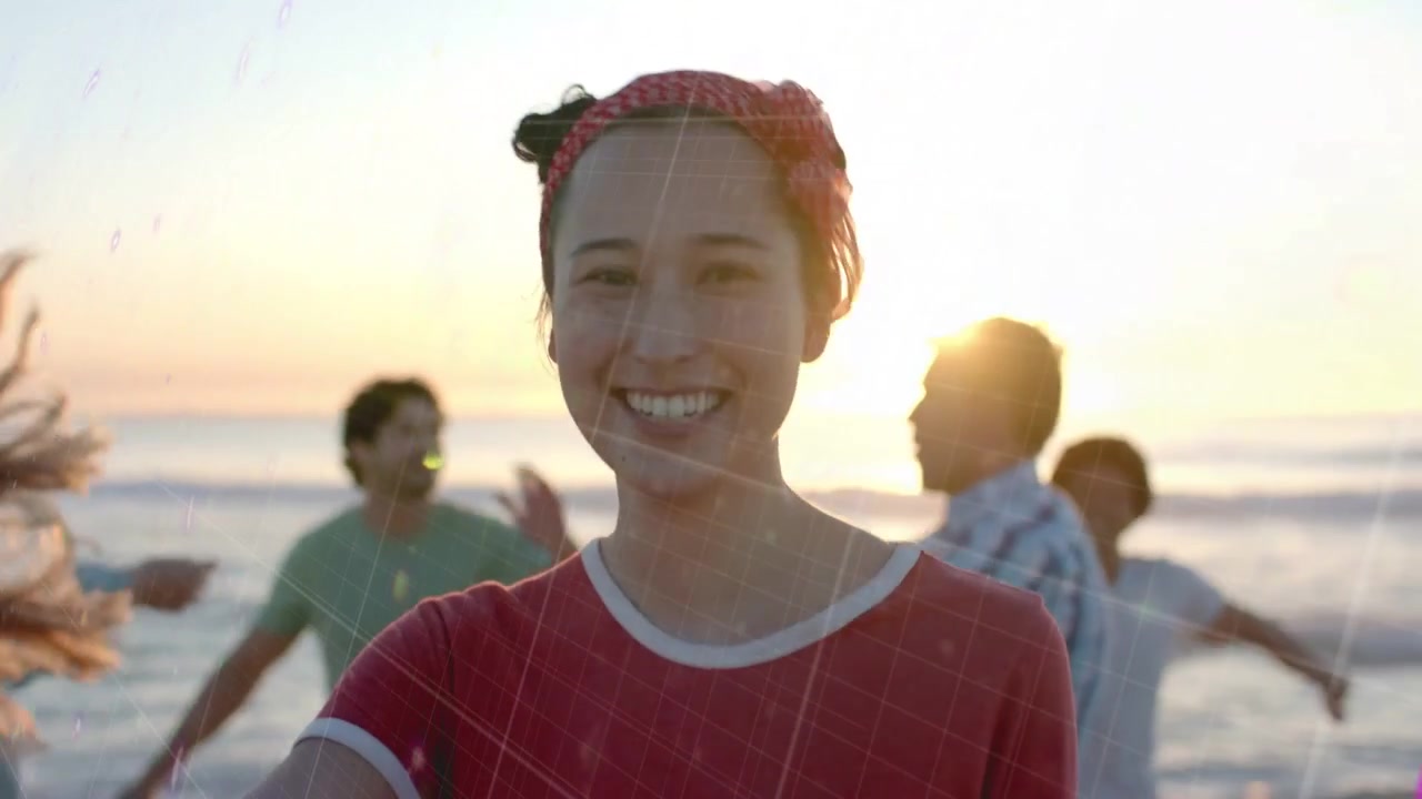 Friends meeting on sunset shore for marketing, overlays appearing rotating revealing smiling woman