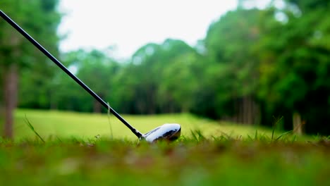 golf sport concept. slow motion golfer hitting golf ball to hole for winner in golf course is beautiful fairway on sunset