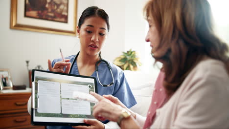 nurse explaining medical information to an elderly woman