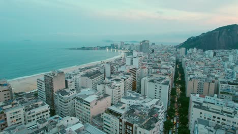 Establishing-of-Copacabana-neighborhood-and-its-beach-in-Rio-de-Janeiro,-Brazil-blue-hour