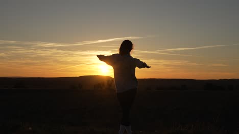 positive energy, good vibes dancing early morning sunrise in nature field