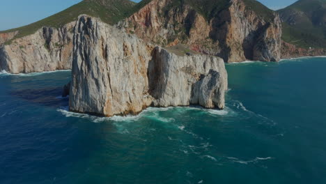 Fantastic-aerial-view-in-orbit-of-Pan-di-Zucchero-on-the-island-of-Sardinia,-near-Masua