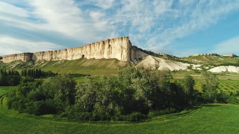 white cliffs and lush valley landscape