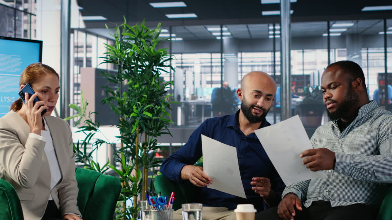 Vertical Video Goal oriented female boss answering a phone call during a meeting