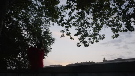 Dancer-dancing-in-golden-hour-time-in-Italy---low-steady-shot-sunset