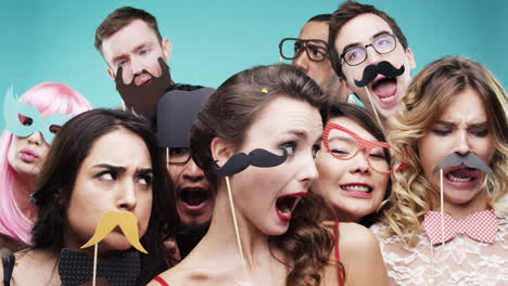 Multi-racial-group-of-funny-people-celebrating-slow-motion-party-photo-booth