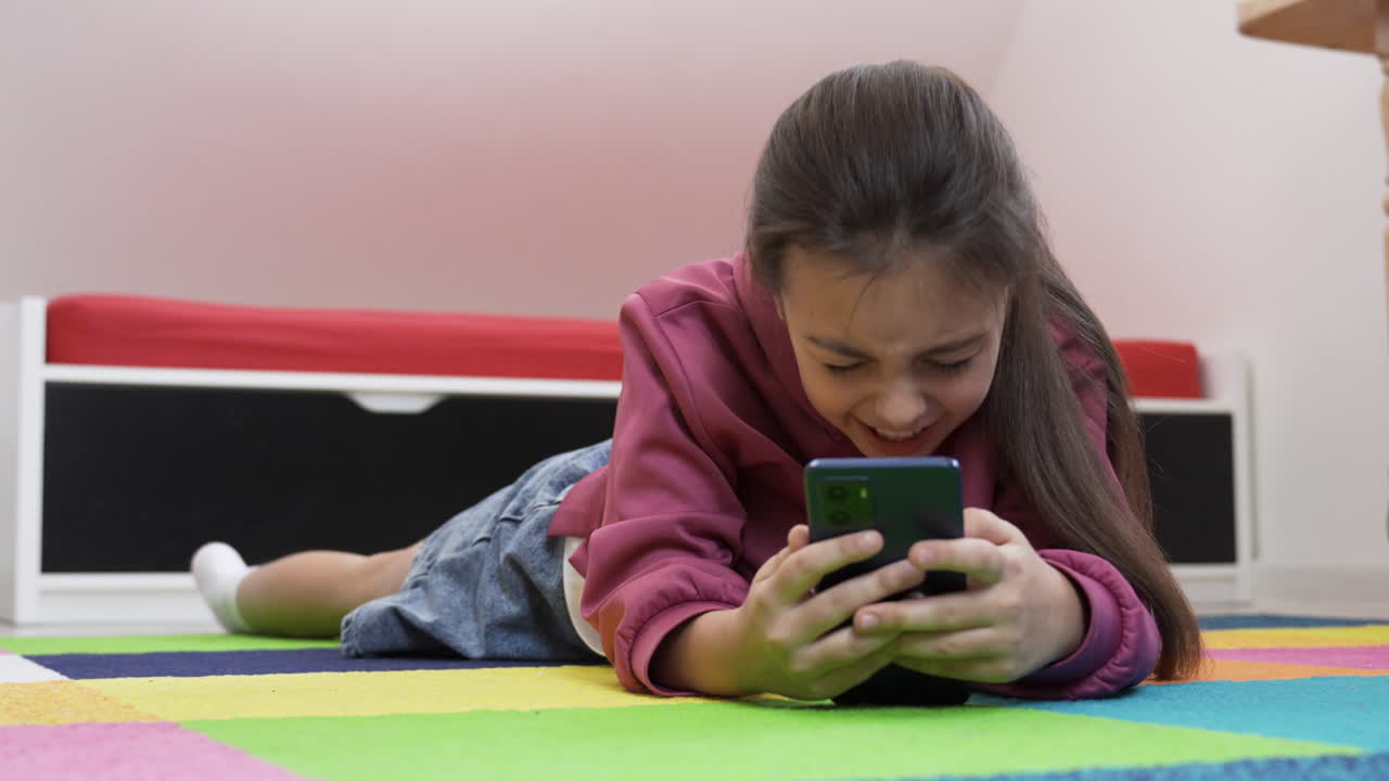 Kids watching movie on laptop